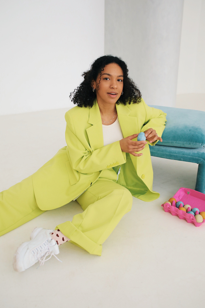 Woman in Bright Green Suit with Easter Eggs